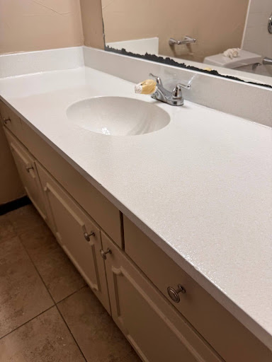 Image of Bathroom Sink and countertop that was transformed from black to white with countertop and sink refinishing services here in Lewisville, Texas