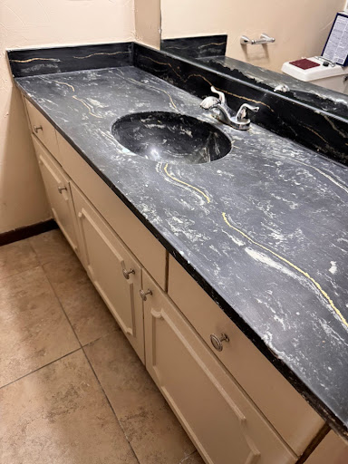 Picture of a Bathroom sink and countertop that is getting resurfaced.