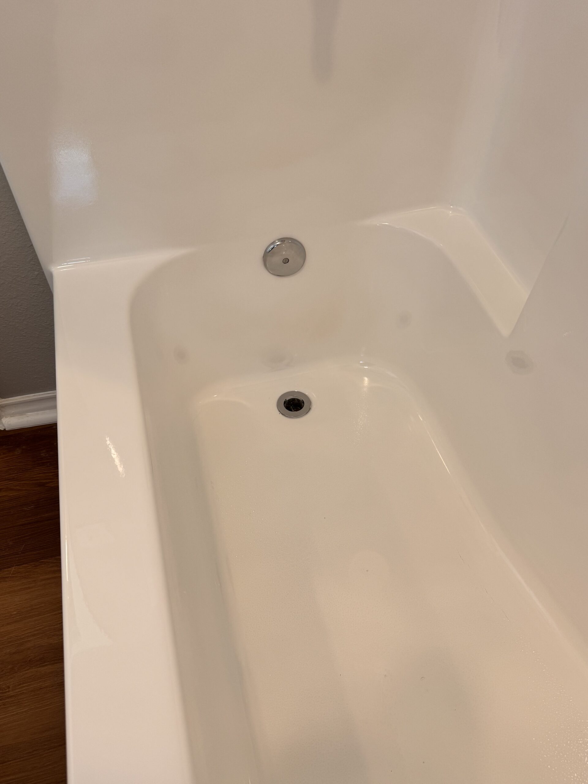 After image of a refinished bathtub with a bright, smooth, and glossy white surface, showing all stains and discoloration removed and the tub fully restored to a like-new condition.