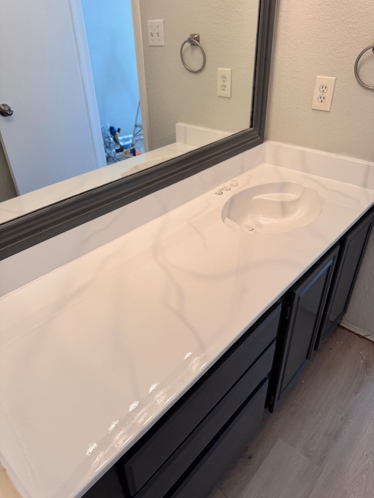 Picture of a bathroom countertop that has been resurfaced.