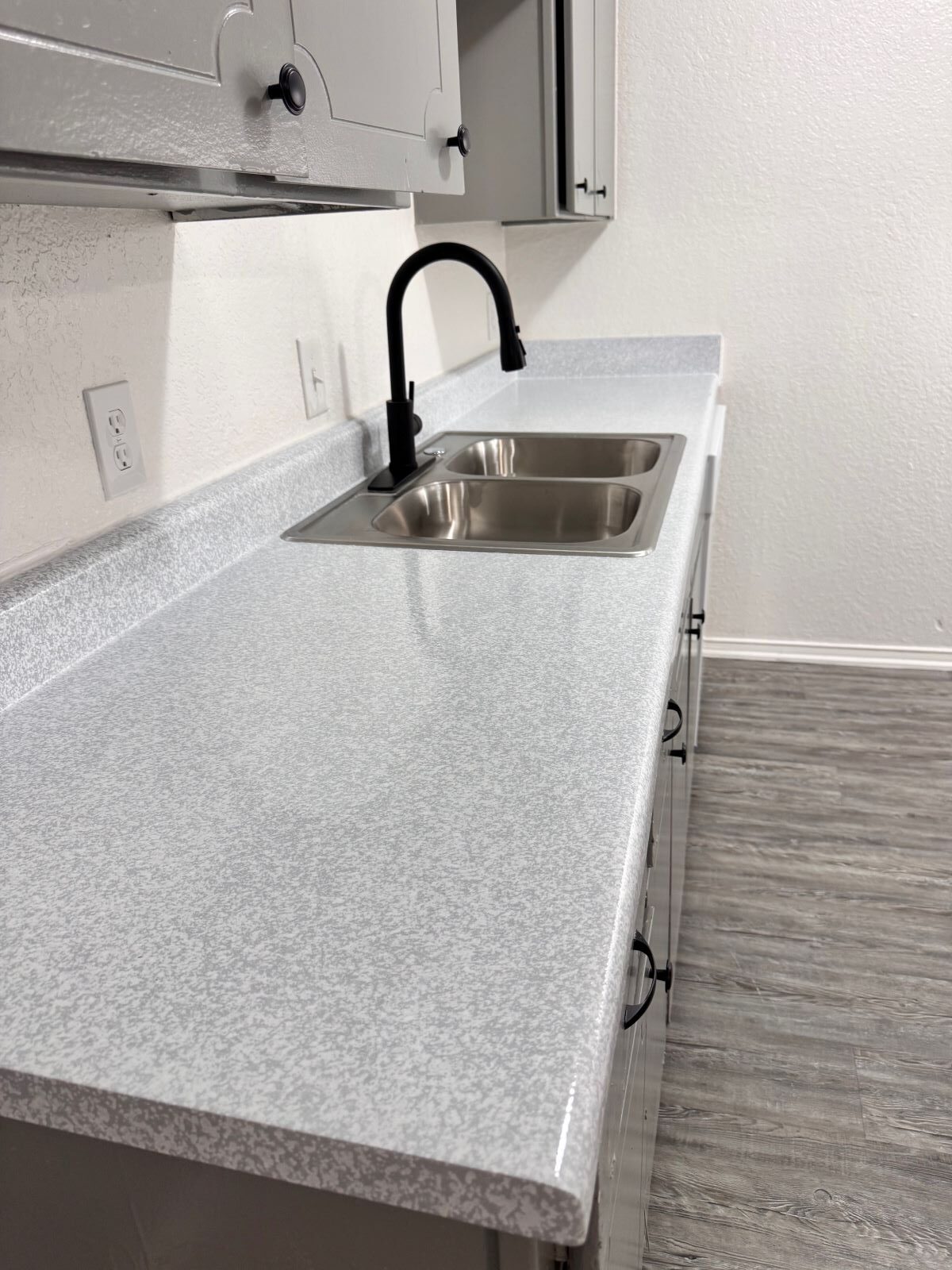 Picture of a kitchen countertop that has just been refinished.