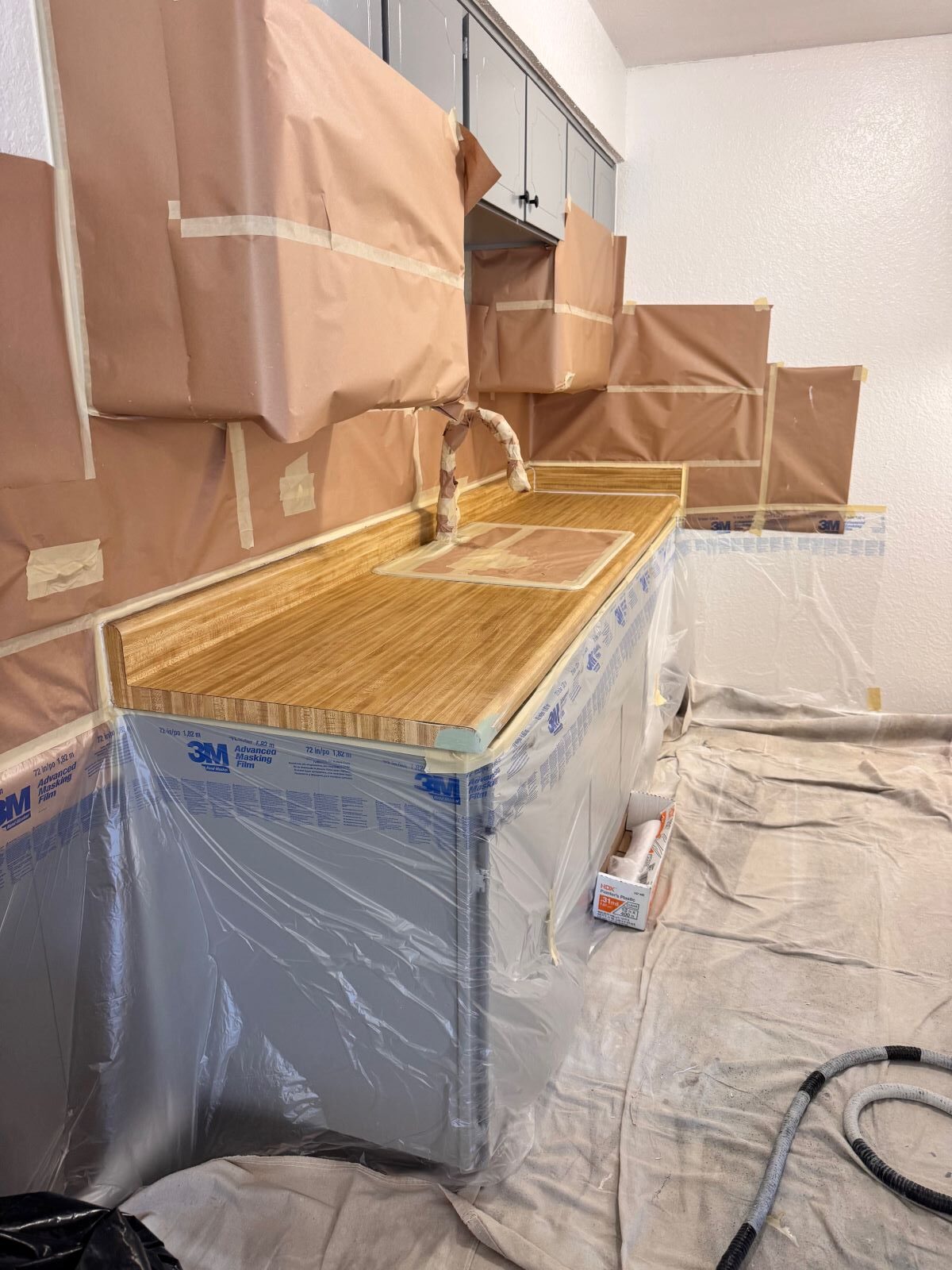 Image of a kitchen countertop that is getting resurfaced.